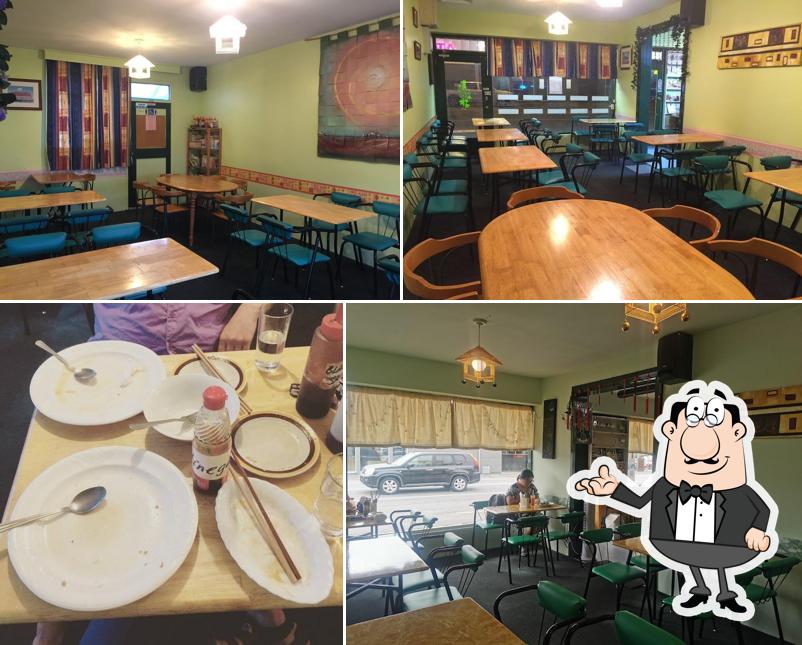 Take a seat at one of the tables at Welcome Chinese Vegetarian Cafe