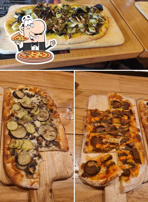 Try out pizza at Meson Asador